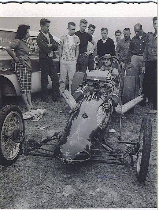 Pit crew and a rail
